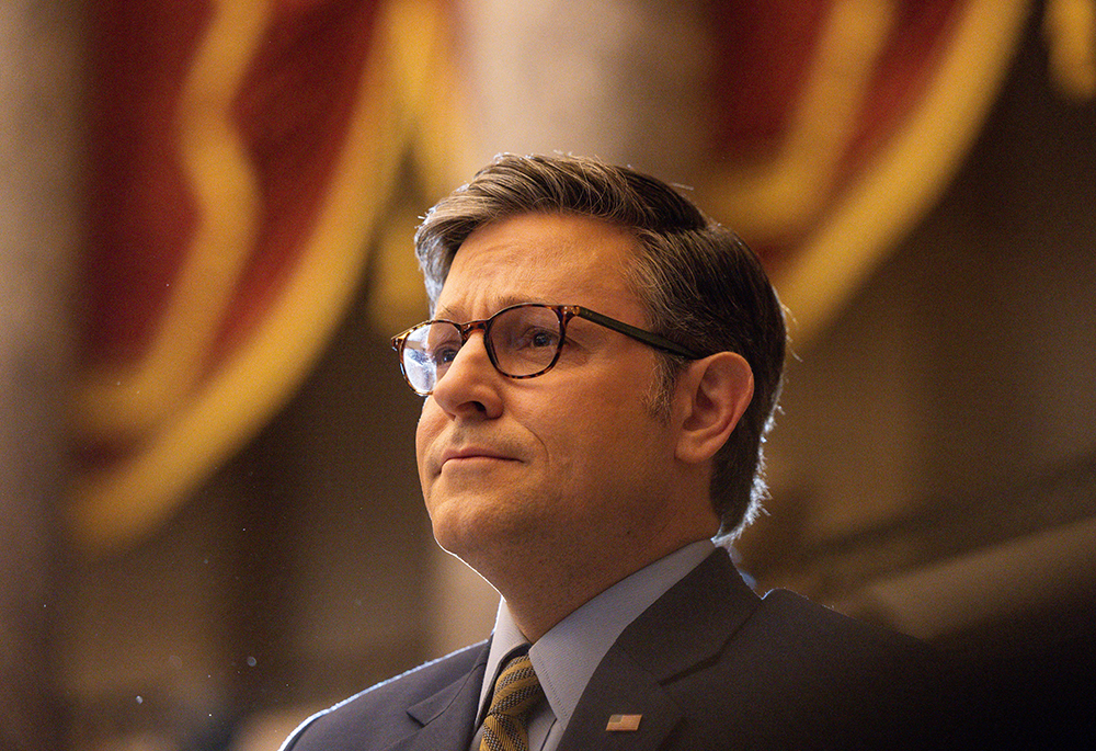 U.S. House Speaker Mike Johnson, R-La., listens to the national anthem during a ceremony in Washington on Dec. 10, 2024. (OSV News/Reuters/Tierney Cross)