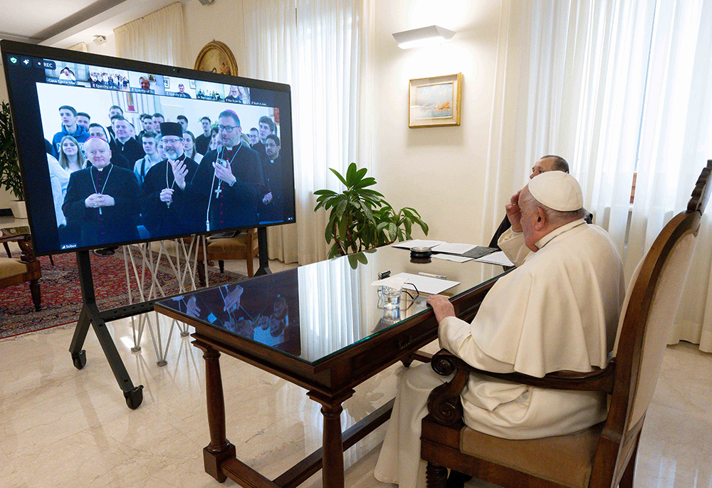 Pope Francis speaks with Major Archbishop Sviatoslav Shevchuk of Kyiv-Halych, head of the Ukrainian Greek Catholic Church, Auxiliary Bishop Jan Sobilo of Kharkiv-Zaporizhzhia, and Archbishop Visvaldas Kulbokas, nuncio to Ukraine, during a video call with young people gathered in the Ukrainian Greek Catholic Cathedral of the Resurrection in Kyiv, on Feb. 1, 2025. (CNS/Vatican Media)