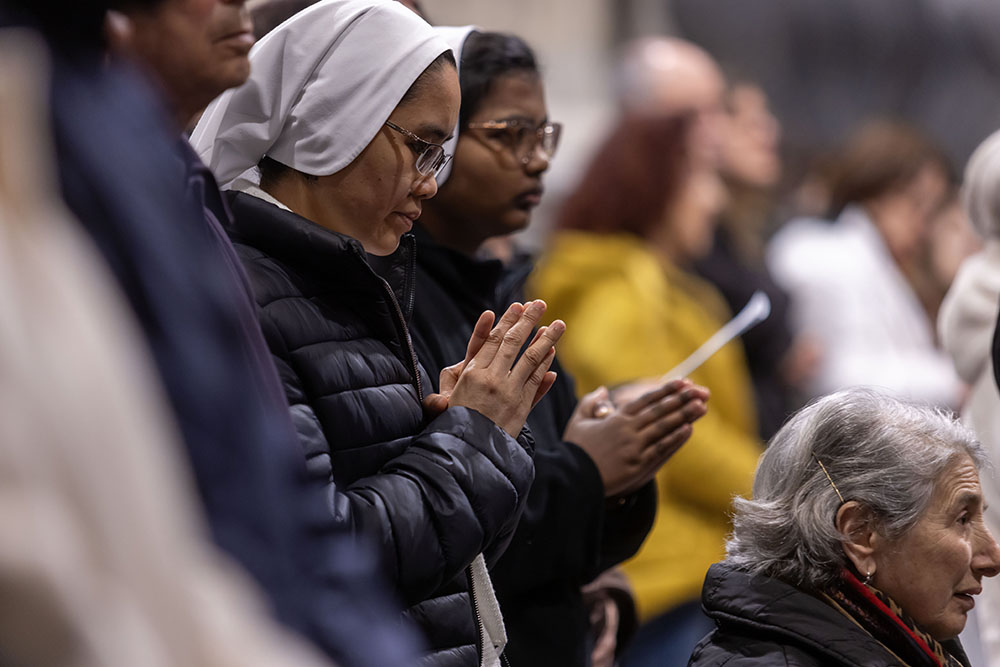 People pray for the ailing Pope Francis during a special evening Mass Feb. 23, 2025, in Rome's Basilica of St. John Lateran. (CNS/Pablo Esparza)