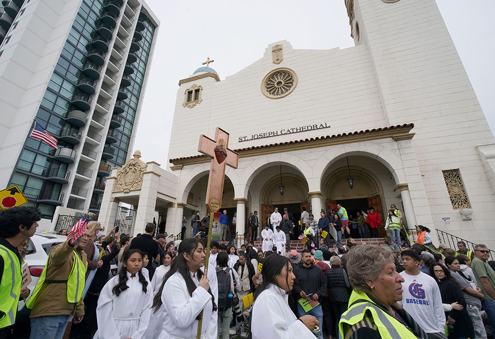 Participants gather outside St. Joseph Cathedral in San Diego on Feb. 9, after a prayer service for immigrants. They were getting ready to take part in a multi-faith procession to the Edward J. Schwartz Federal Building in San Diego where they held a prayer vigil. (NCR photo/Chris Stone)