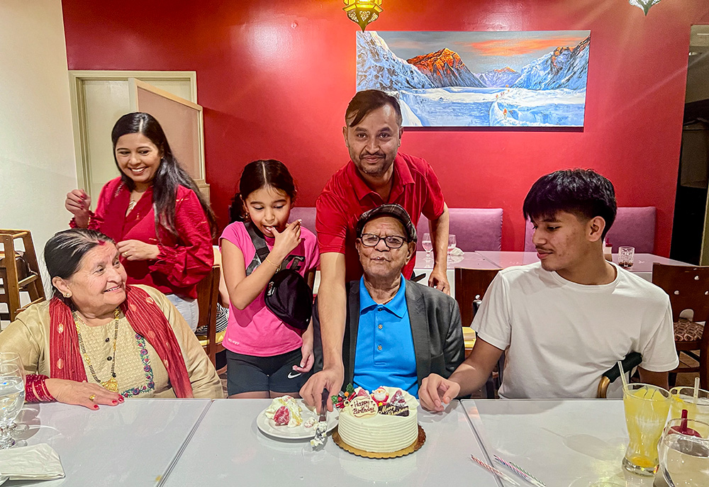 Leela Kuikel celebrates his father's birthday with his mother, his wife and their children. (Courtesy of Leela Kuikel)