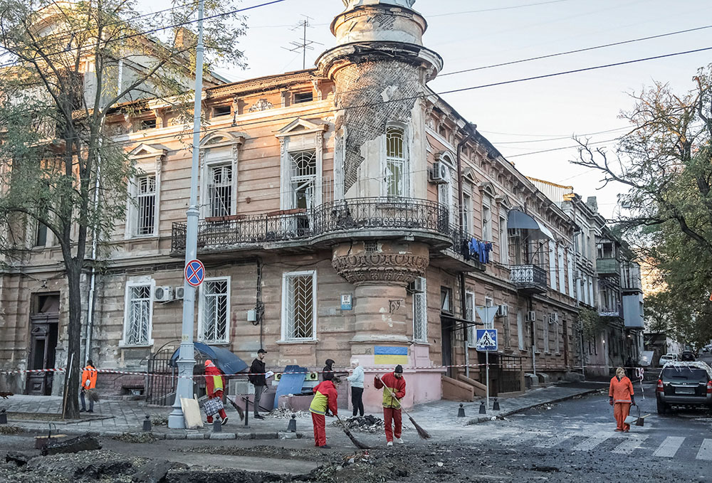 Municipal workers clean an area at the site of a Russian missile strike amid Russia's attack on Ukraine, in Odesa, Ukraine, Nov. 6, 2023. (OSV News/Reuters/Nina Liashonok)