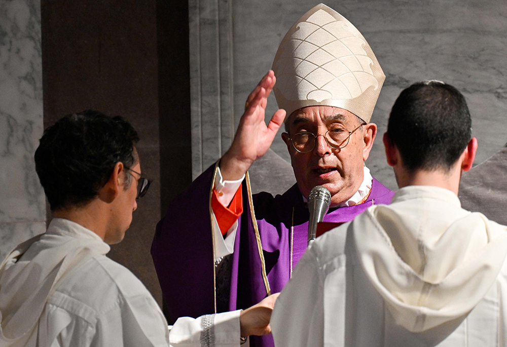 Cardinal Angelo De Donatis, head of the Apostolic Penitentiary, gives his blessing at the conclusion of Ash Wednesday Mass in the Basilica of Santa Sabina, March 5 in Rome. Pope Francis, who is hospitalized, delegated the cardinal to preside at the liturgy. (CNS/Vatican Media)