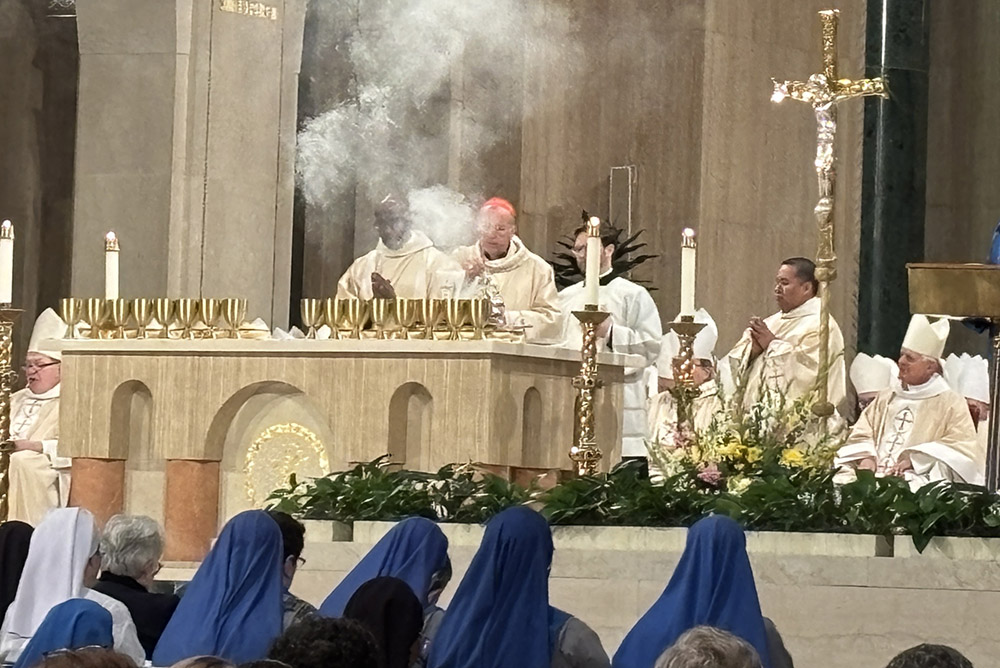 Washington Cardinal Robert McElroy uses incense during Eucharistic prayers during his installation Mass March 11 at the Basilica of the Shrine of the Immaculate Conception. (NCR photo/James V. Grimaldi)