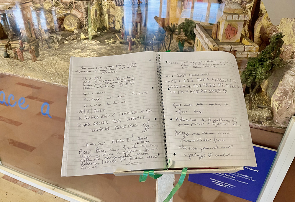 A few feet from the Gemelli chapel, a large register of more than 500 pages has been completely filled with messages and prayers for the pope. (NCR photo/Camillo Barone)