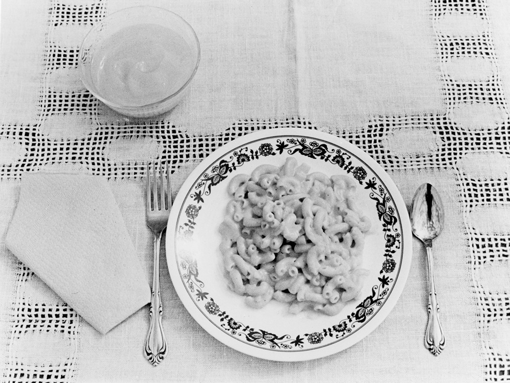 With the Operation Rice Bowl program going national in 1976, families were urged to prepare one sacrificial meal each week of Lent and offer the money saved to help feed the starving people of the world. This example for a simple meal from 1976 consists of macaroni and cheese, and vanilla pudding. (CNS/Robert H. Davis)