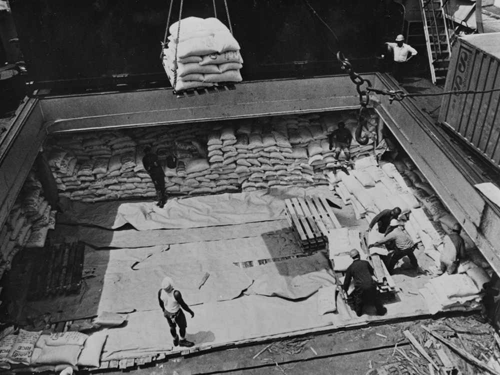 Workers in Philadelphia load a shipment of rice bound for Bangladesh in summer 1976, in a relief effort handled by Catholic Relief Services, using funds from the first national Operation Rice Bowl campaign. (CNS/Bob Strawn)