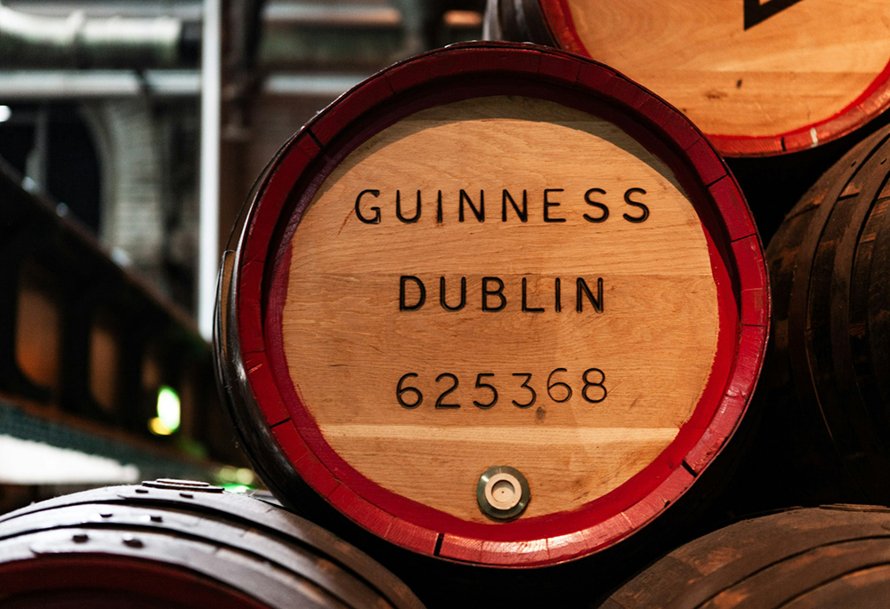 A close-up shot of a barrel displays the label "Guinness Dublin 625368" (Unsplash/Steve Wrzeszczynski)