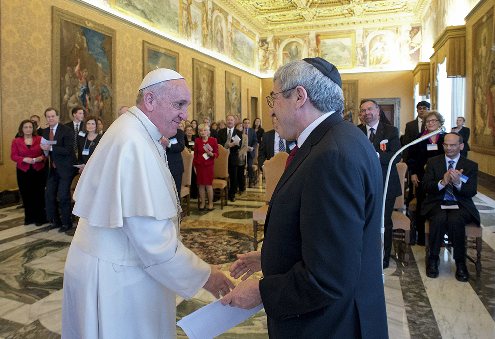 Pope Francis greets Stanley Bergman, president of the American Jewish Committee, during a meeting at the Vatican on Feb. 13, 2014. The pope said then that the modern relationship between Jews and Catholics has a "theological foundation" and is "not simply an expression of our desire for reciprocal respect and esteem." (CNS/Reuters/L'Osservatore Romano)