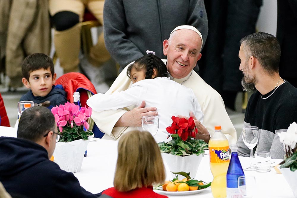 Pope Francis joins some 1,300 guests for lunch in the Vatican audience hall on the World Day of the Poor Nov. 13, 2022. Francis, formerly Argentine Cardinal Jorge Mario Bergoglio, died April 21, 2025, at age 88. (CNS/Reuters/Remo Casilli)