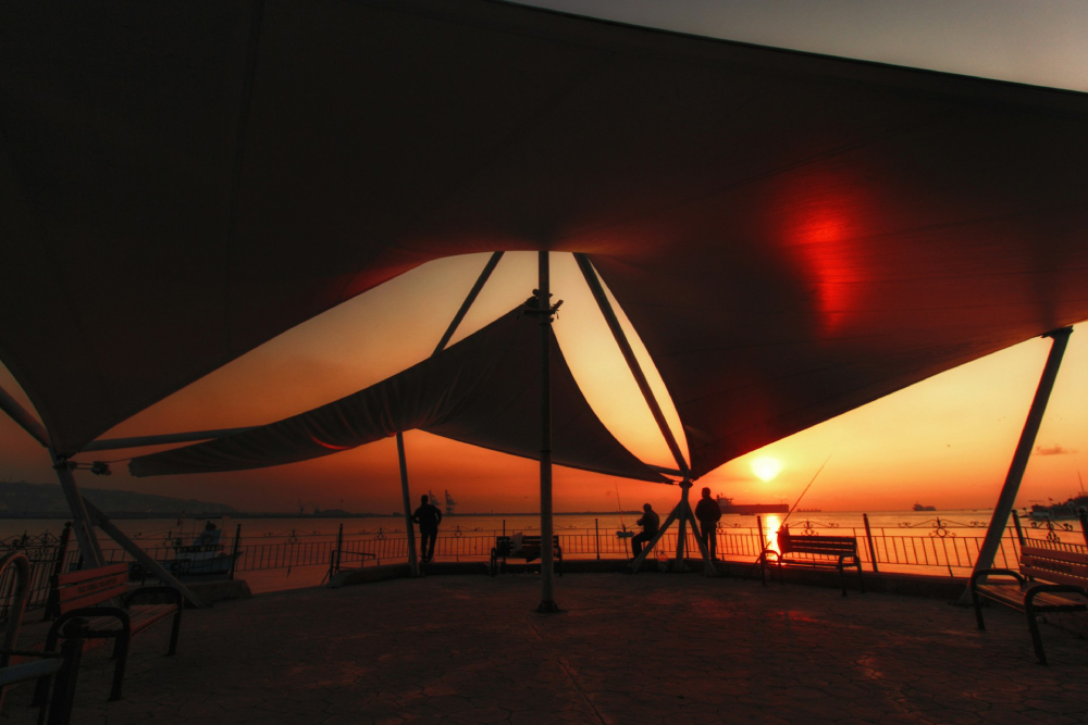 Tent Geometric tent on a beach in Ereğli, Zonguldak, Turkey during a warm sunset.