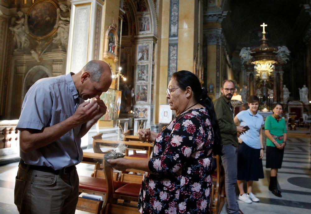 Archbishop Donald J. Bolen of Regina, Saskatchewan, participates in a smudging ceremony in Rome Oct. 18, 2019. (CNS/Paul Haring) 