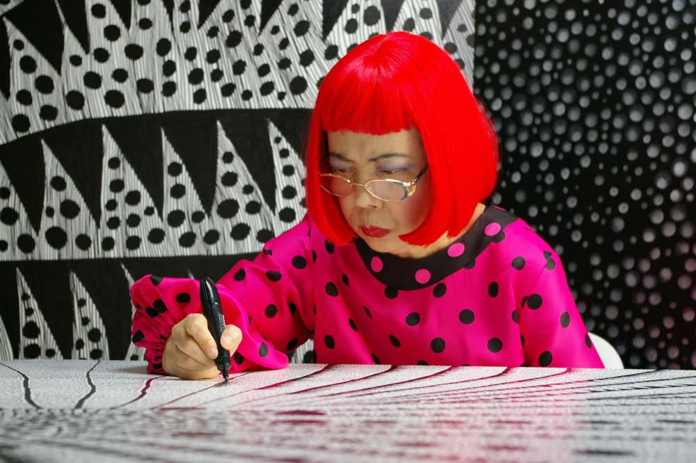 Artist Yayoi Kusama draws in "Kusama: Infinity." (Courtesy of Magnolia Pictures/Tokyo Lee Productions Inc.)