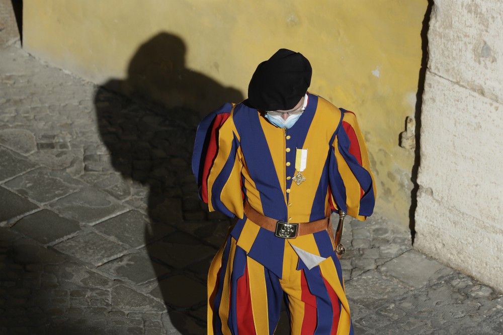 A Vatican Swiss Guard wears a face mask to prevent the spread of COVID-19 in the San Damaso courtyard ahead of Pope Francis' general audience Sept. 2 at the Vatican. (AP Photo/Andrew Medichini, file)