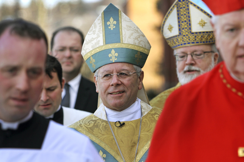 Bishop Peter Libasci, center, arrives at the Cathedral of St. Joseph for his installation service as bishop of the Diocese of Manchester, Dec. 8, 2011, in Manchester, New Hampshire. (AP file/Jim Cole)