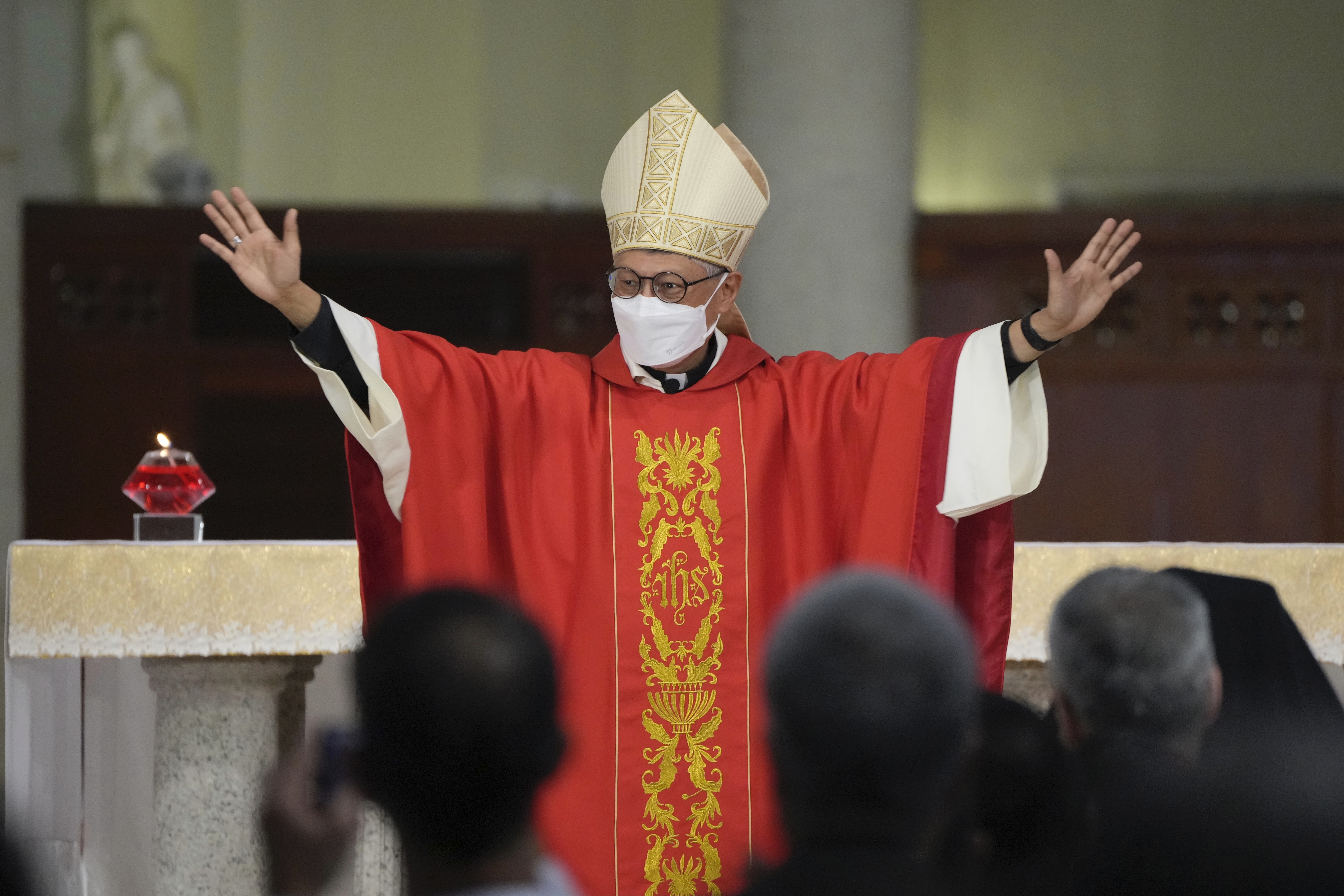 Stephen Chow waves at the episcopal ordination ceremony as the new Bishop of the Catholic Diocese, in Hong Kong, Saturday, Dec. 4, 2021. (AP Photo/Kin Cheung)