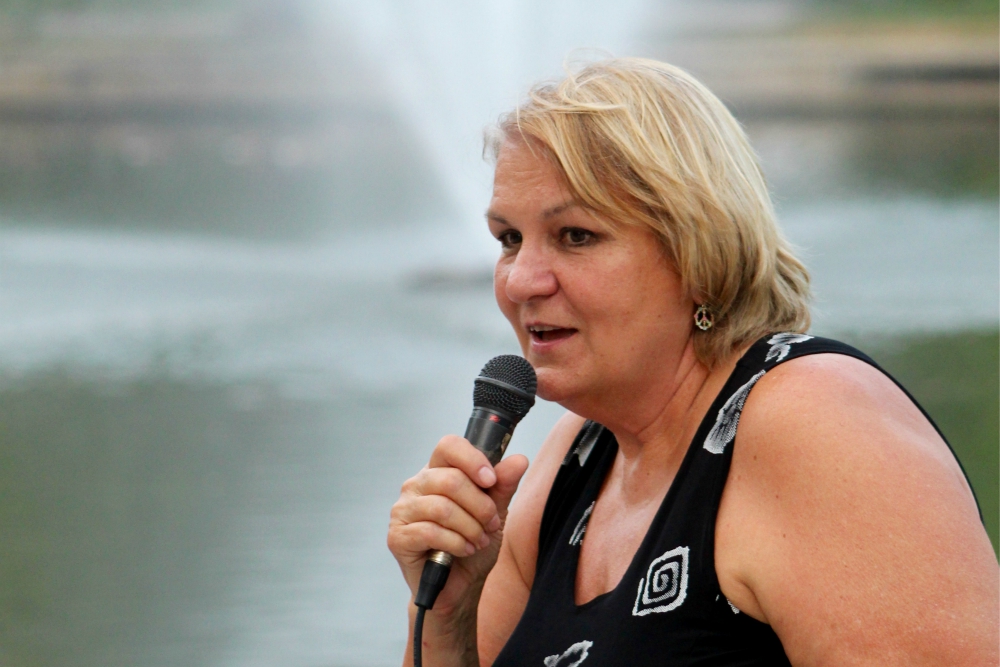 Ann Suellentrop reports on civil resistance actions she took in Germany this summer during the Hiroshima/Nagasaki Remembrance memorial Aug. 5 in Kansas City, Missouri. (Jim Hannah)