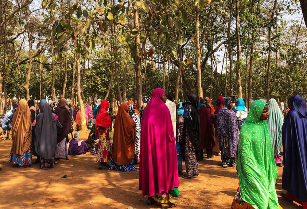 A group of women gather outside Area 1 IDP Camp for internally displaced persons in Abuja, Nigeria. (Chinedu Asadu)