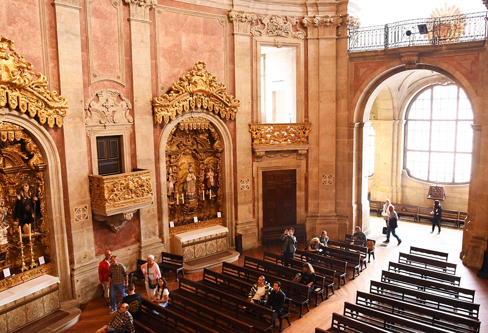 People are seen in Igreja dos Clérigos ("Church of the Clergy") in Porto, Portugal, in January 2019. (Dreamstime/Ksenija2015)