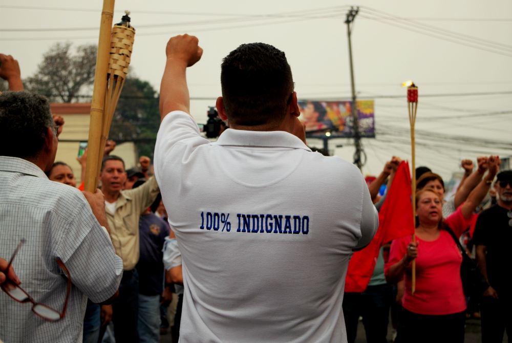 People march April 26 in Tegucigalpa, Honduras, protesting corruption and the government of President Juan Orlando Hernández. (Dreamstime/Herbert Soriano)