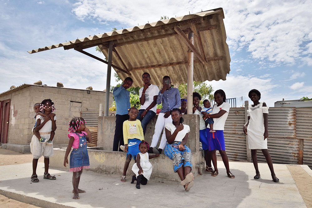 People are seen after Sunday Mass in Baía Farta in Angola's Benguela Province. (Dreamstime/Igor Kiporuk)