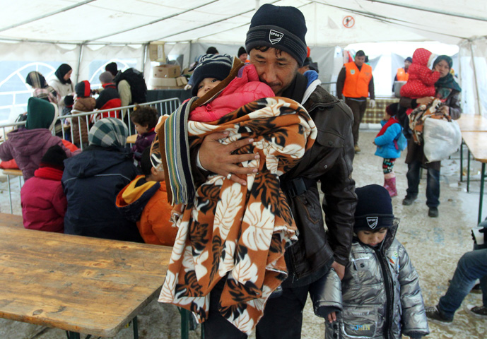 Migrants from Syria, Iraq and Afghanistan arrive at the transit and registration camp in the town of Presevo, southern Serbia, Nov. 24. (CNS/Djordje Savic, EPA)