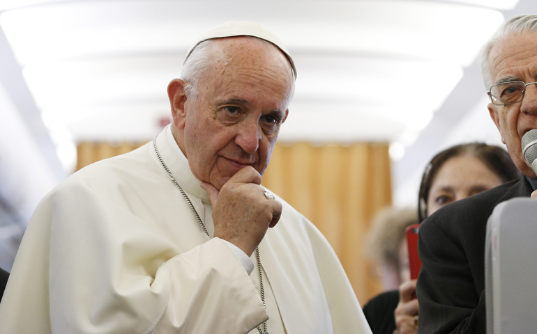 Pope Francis is pictured while meeting journalists aboard his flight from Rome to Yerevan, Armenia, June 24. The pope was beginning a three-day visit to Armenia. (CNS/Paul Haring)