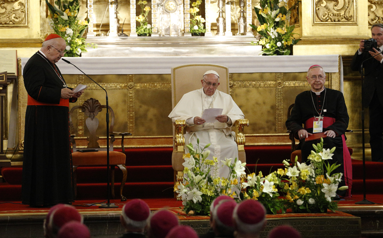 Pope Francis listens as Cardinal Stanislaw Dziwisz of Krakow, Poland, speaks during a meeting with Poland's bishops at the cathedral in Krakow, Poland, July 27. At right is Archbishop Stanislaw Gadecki, president of the Polish bishops conference. (CNS/Paul Haring)