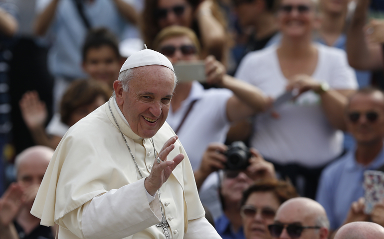 Pope Francis greets the crowd during his general audience in St. Peter's Square at the Vatican Aug. 31. (CNS/Paul Haring)