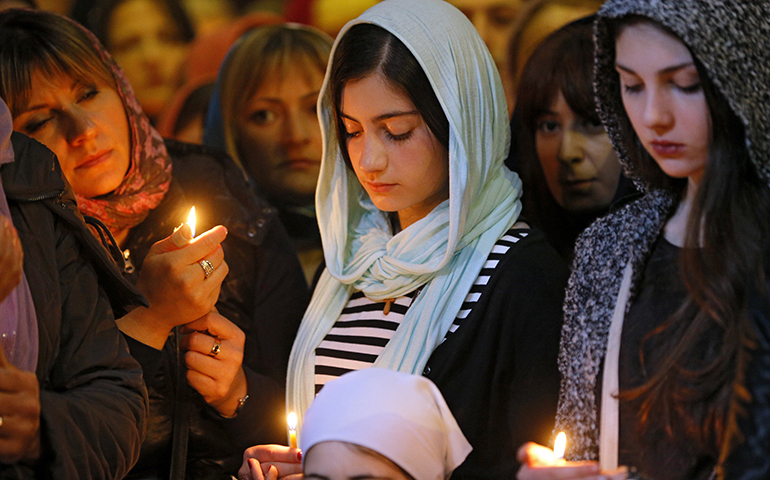 Georgian Orthodox believers attend a religious service April 7 in Mtskheta, near Tbilisi, Georgia. (CNS/Zurab Kurtsikidze, EPA) 