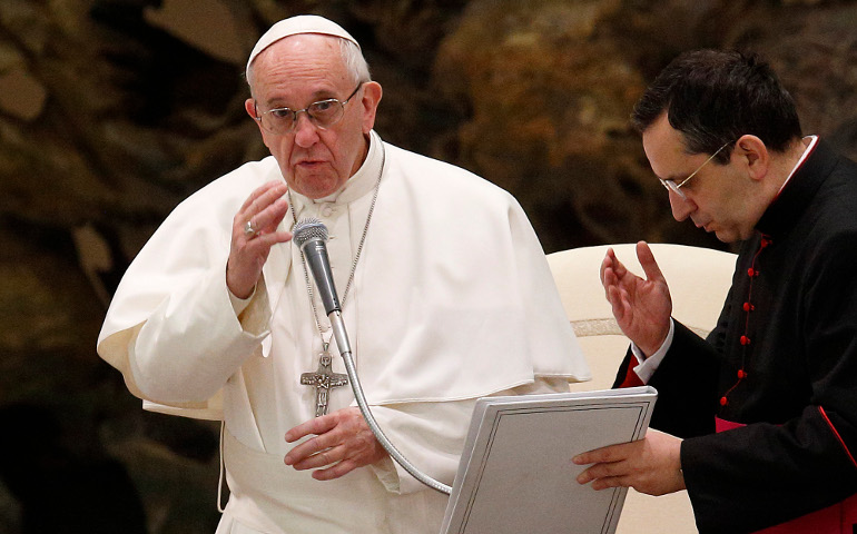 Pope Francis delivers his blessing during his general audience in Paul VI hall at the Vatican Jan. 18. (CNS photo/Paul Haring)