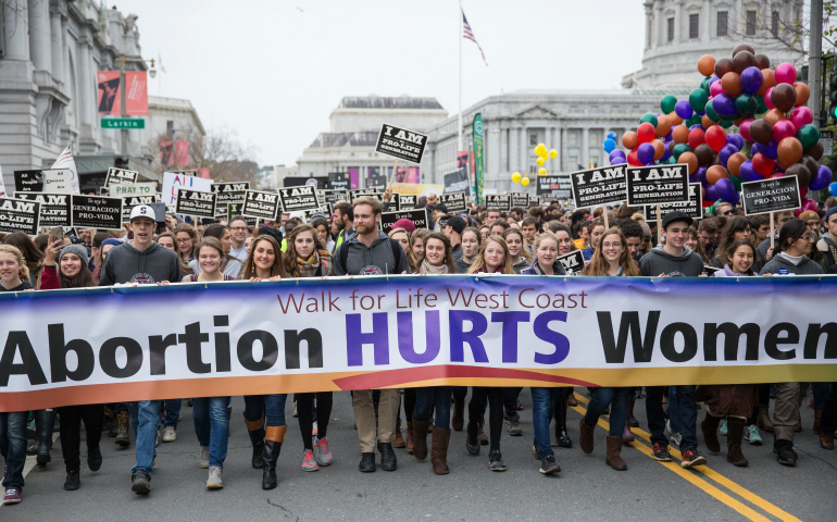 Participants carry a banner during the annual Walk for Life West Coast in San Francisco Jan. 21. (CNS photo/Jose Aguirre, Walk for Life West Coast)