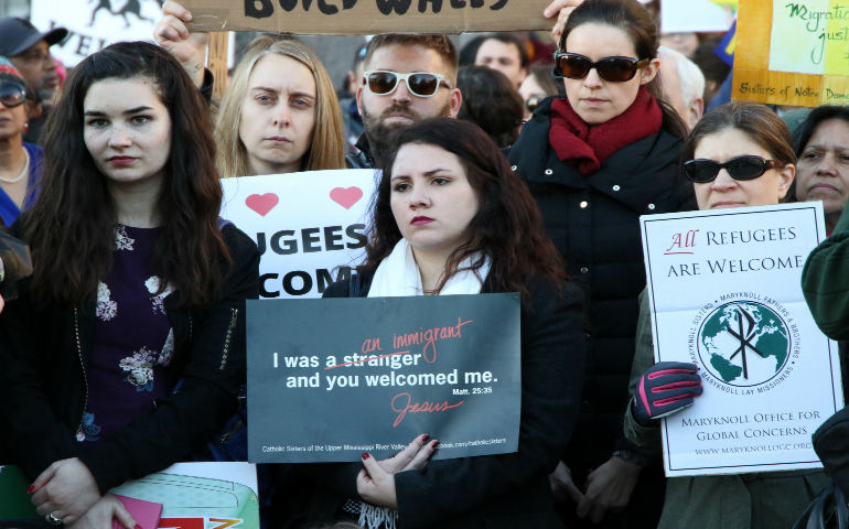 People protest against President Donald Trump's immigration policies during a demonstration near the White House in Washington Jan. 25. (CNS photo/Gregory A. Shemitz)