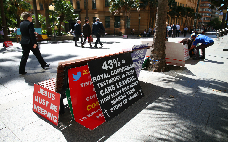 A display of protest placards sit outside the Royal Commission into Child Sex Abuse Feb. 23 in Sydney. (CNS photo/David Moir, EPA)