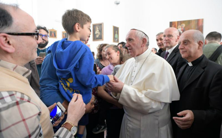 Pope Francis greets a child as he visits the Sant' Alessio-Margherita di Savoia Regional Center for the Blind March 31 in Rome. (CNS photo/L'Osservatore Romano)