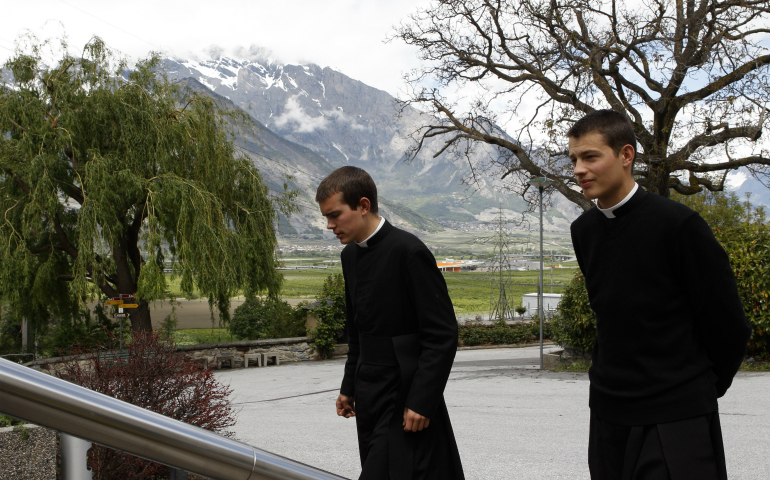 Seminarians walk on the grounds of the Society of St. Pius X seminary in Econe, Switzerland, in this May 9, 2012, file photo. (CNS photo/Paul Haring)