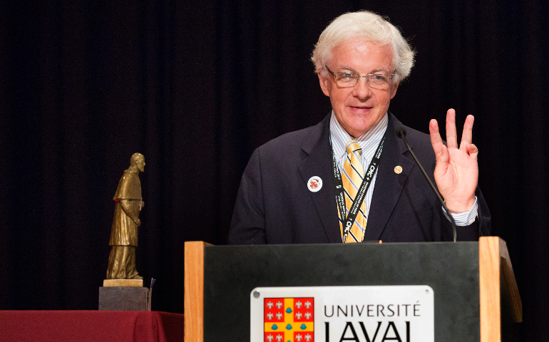 Matthew Schiller, outgoing president of the Catholic Press Association and the business and advertising manager at Catholic New York, accepts the St. Francis de Sales Award June 23 during the 2017 Catholic Media Conference in Quebec City. Schiller holds up three fingers to illustrate how many times he had been nominated for the award, the highest honor given by the CPA. (CNS/Chaz Muth) 