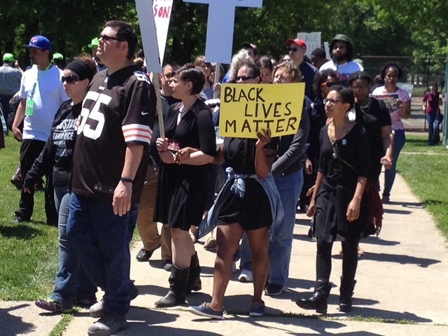 Demonstrators walk through the neighborhood near Christine Schenk's motherhouse on May 23, the day the Brelo decision was announced. The peaceful demonstration was conducted in memory of Tamir Rice. (Christine Schenk)