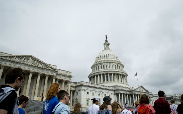 People walk near the U.S. Capitol in Washington June 7. Former FBI Director James Comey testified June 8 before a Senate Intelligence Committee hearing on Russia's alleged interference in the 2016 U.S. presidential election. (CNS photo/Tyler Orsburn)