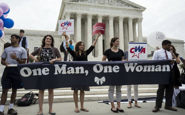 Supporters of traditional marriage between a man and a woman rally in front of the U.S. Supreme Court in Washington June 26, 2015,shortly before the justices handed down a 5-4 ruling that states must license same-sex marriages and must recognize same-sex marriages performed in other states. (CNS photo/Joshua Roberts, Reuters)