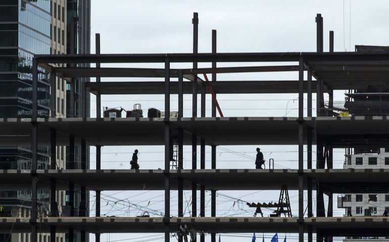 Ironworkers are seen in Boston April 28, 2014. (CNS photo/CJ Gunther, EPA)