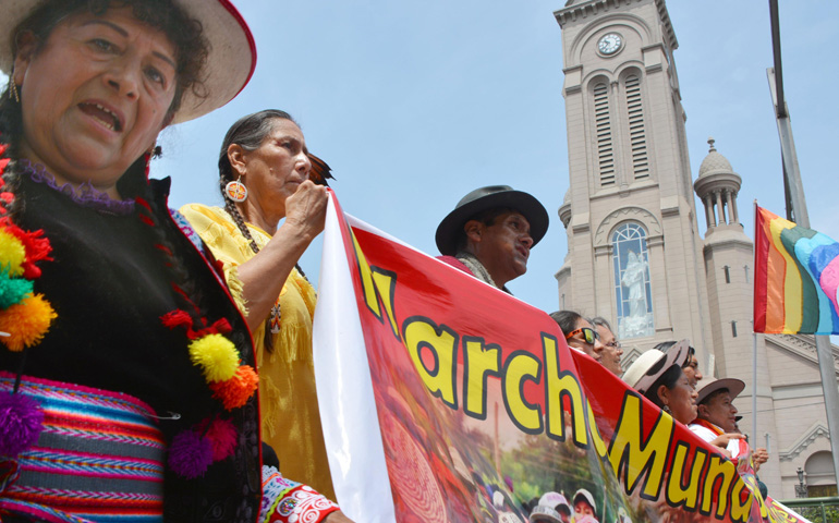 Thousands join a "People's Climate March" in Lima, Peru, Dec. 10, while international climate negotations are underway in the city. (Newscom/Kyodo)