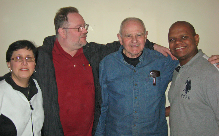 Fr. Andy Connolly, second from right, with his foster son, Louie Krieger, in red, Krieger's wife, and Julio Ramirez, who is from the pueblo where Connolly worked in the Dominican Republic