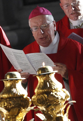 Bishop Cirilo B. Flores of San Diego prays in front of the tomb of St. Peter in April 2012 in St. Peter's Basilica at the Vatican. (CNS/Paul Haring) 