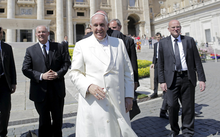 Pope Francis smiles after leading his weekly audience Wednesday in St. Peter's Square at the Vatican. (CNS/Reuters/Tony Gentile)