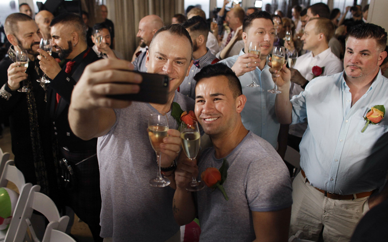 Couples take part in a same-sex wedding ceremony Feb. 5 in Fort Lauderdale, Fla. Florida was the 36th state to make same-sex marriage legal. (CNS/Reuters/Javier Galeano)