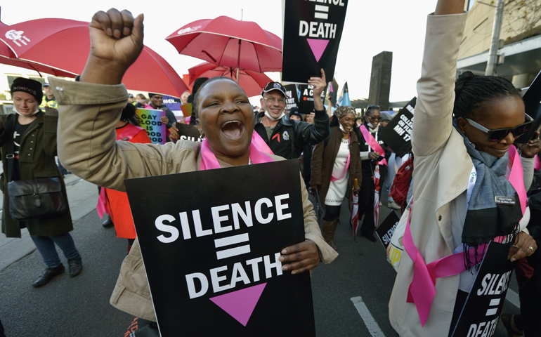 Demonstrators demand an end to stigma and discrimination against people living with HIV at a march Tuesday during the 20th International AIDS Conference in Melbourne, Australia. (CNS/Paul Jeffrey)