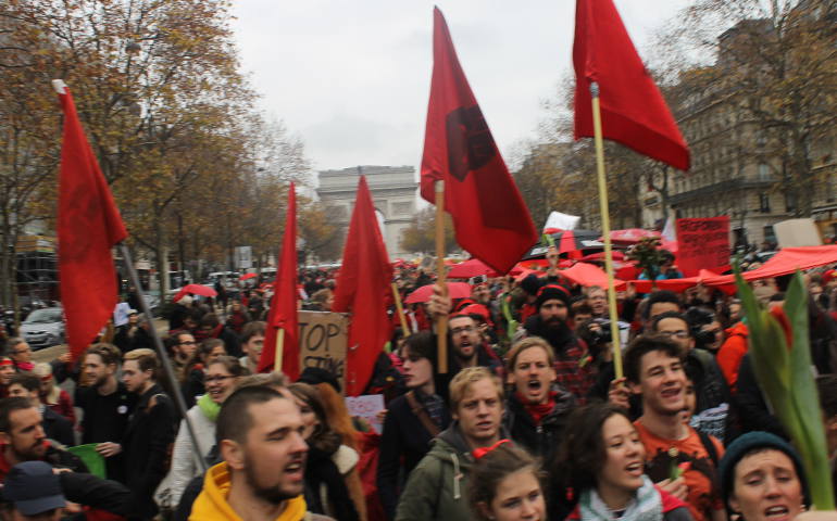 Thousands assembled along the Avenue de la Grande Armee in Paris Dec. 12 hours before 195 nations adopted the Paris Agreement, which provides a framework for global climate action. (NCR photos/Brian Roewe)