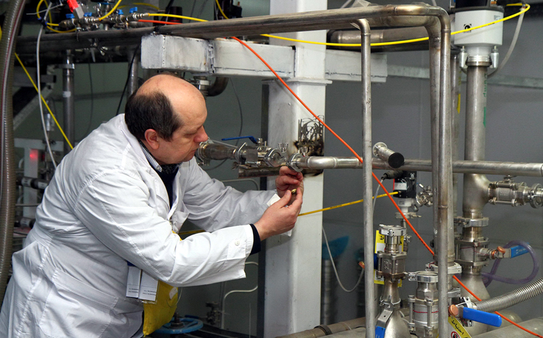 An International Atomic Energy Agency inspector checks the uranium enrichment process inside Iran's Natanz plant in January 2014. (CNS/EPA/Kazem Ghane)