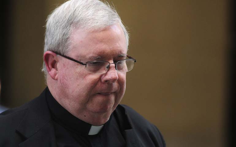 Msgr. William Lynn, former secretary of clergy in the Archdiocese of Philadelphia, leaves a Philadelphia courthouse in late May as the jury deliberates in his trial on child endangerment charges. (CNS/Reuters/Scott Anderson)